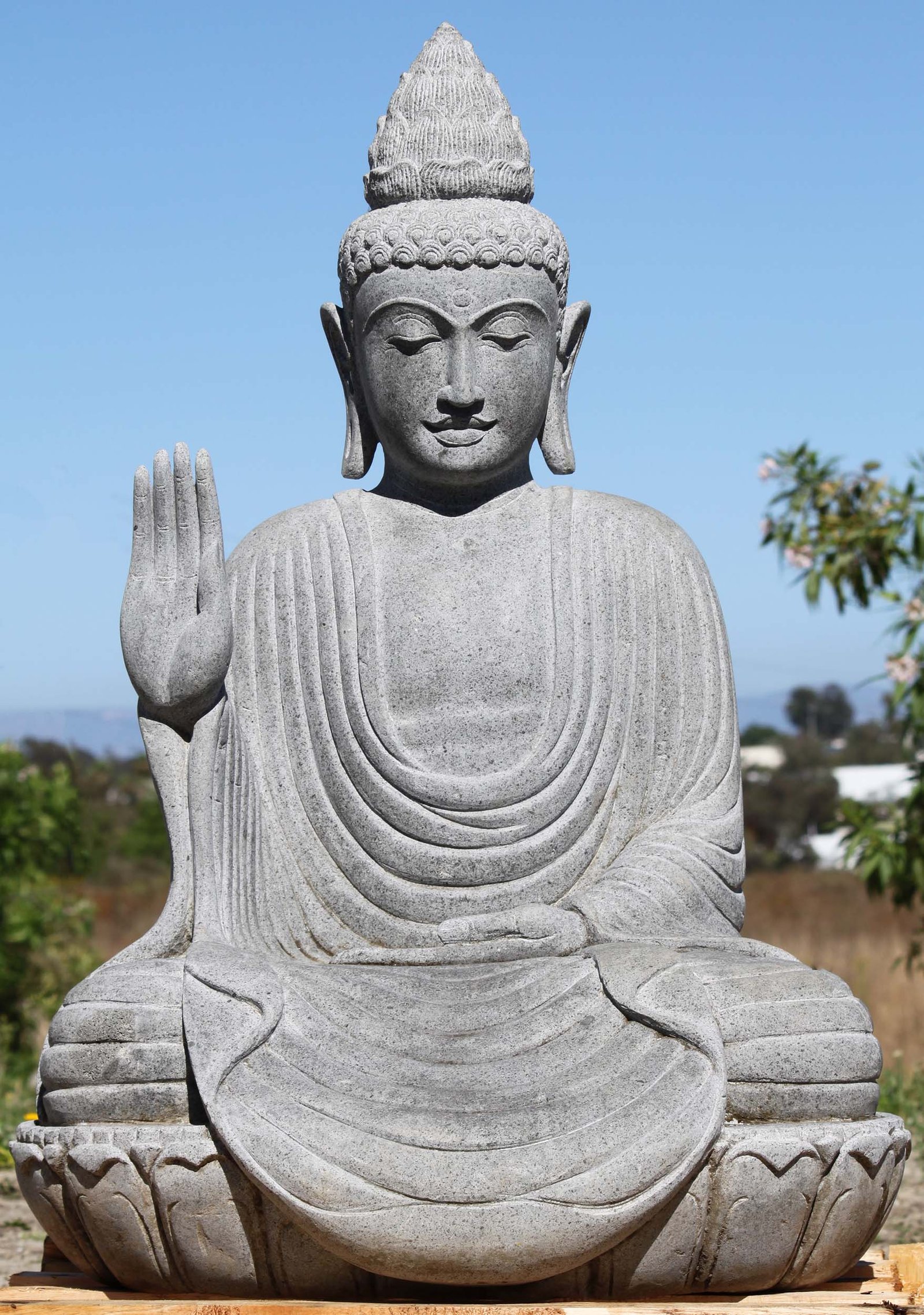 Buddha statue Abhaya mudra meaning protection and fearlessness