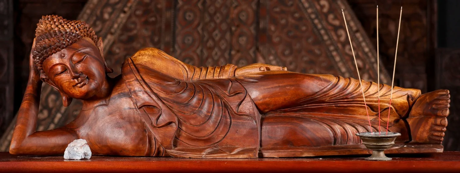 Reclining Buddha statue representing Parinirvana and peace